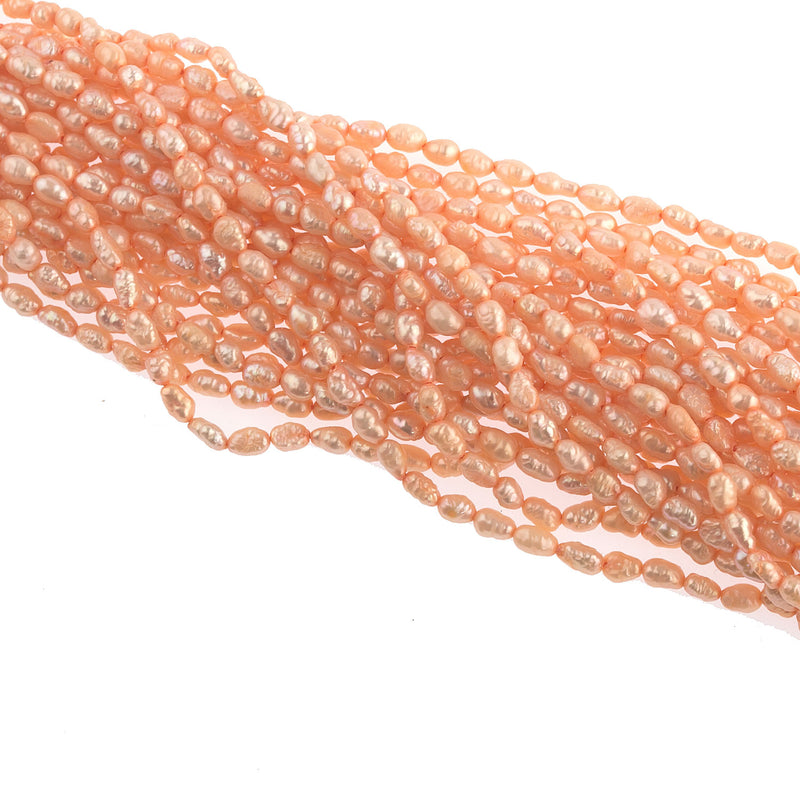 Vintage color treated iridescent freshwater oval rice pearl. Avg. 5x3mm, 16 inch strand. 
