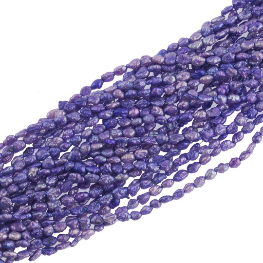 Vintage color treated iridescent freshwater oval rice pearl. Avg. 5x3mm, 16 inch strand. b15-prl123