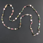 Tourmaline, garnet, topaz, pearl and 14k gold necklace.  32 inches