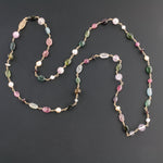 Tourmaline, garnet, topaz, pearl and 14k gold necklace.  32 inches