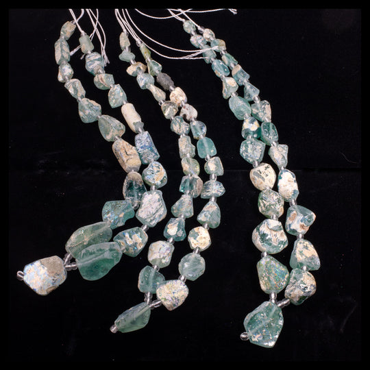 Ancient Bactrian Glass Beads, aqua blues, excavated and reworked. 1 Strand.  b11-mi-2075