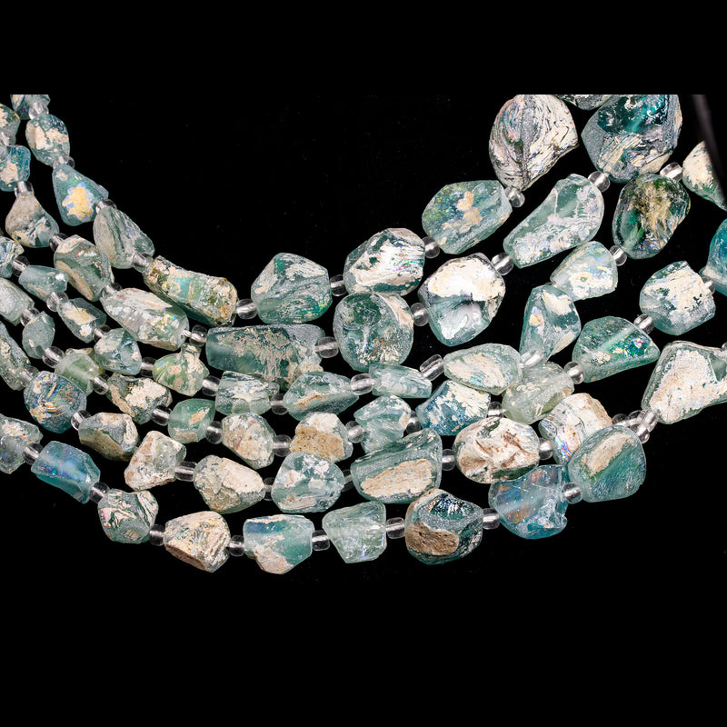 16 inch strand of excavated and reworked ancient glass beads with high rainbow burial patina.