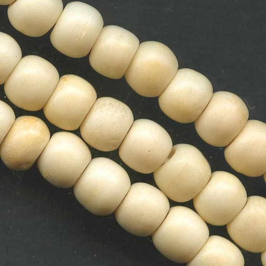 Vintage carved bone rounds. 6x7mm pkg of 25. b3-bo144