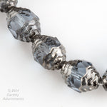 Czech 10 x 8mm Alexandrite  faceted glass oval bead with silvered circular edges. Pkg4.