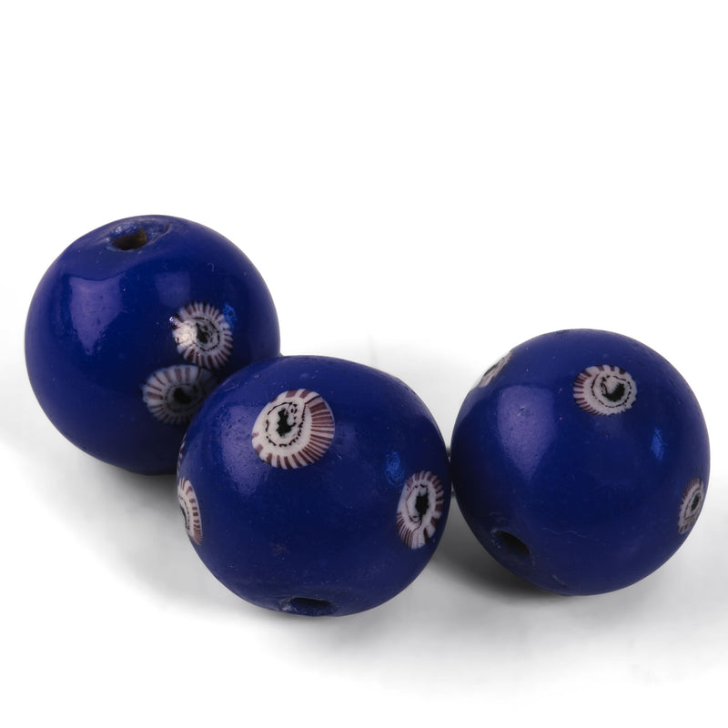 Chinese cobalt blue Peking glass bead with millefiori 18-20mm. Sold individually.