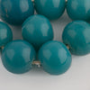 Old Peking glass 19x20mm round bead in opaque teal. sold individually.