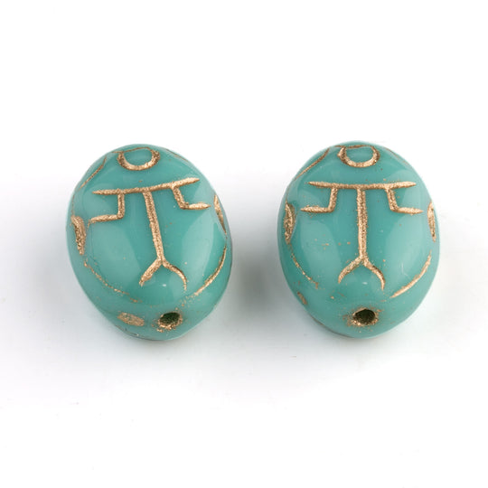 Czech pressed turquoise glass scarab bead with gold decor. 14x10x7mm. Pkg 2. b11-bl-2136