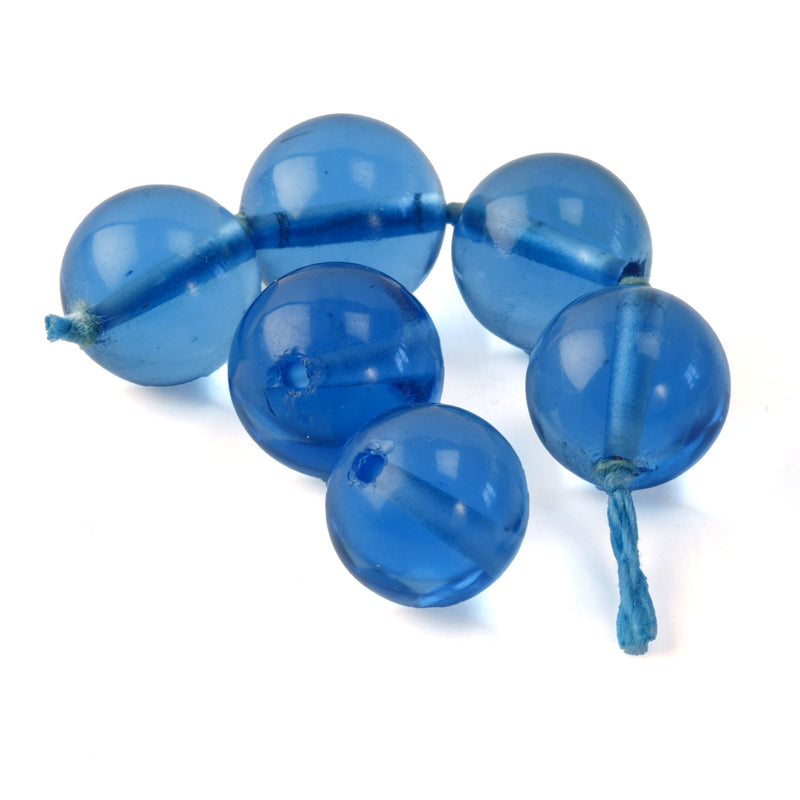 Luminous translucent blue glass beads from Czechoslovakia.  1980s. 11-12mm. Pkg 6.