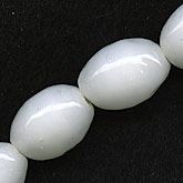 Vintage Japanese glossy alabaster glass oval shaped beads. 8x10mm. Pkg of 10. 
