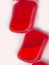 B11-RD-0763 Parallelogram of lipstick red swirls. 8x14mm Pkg of 5