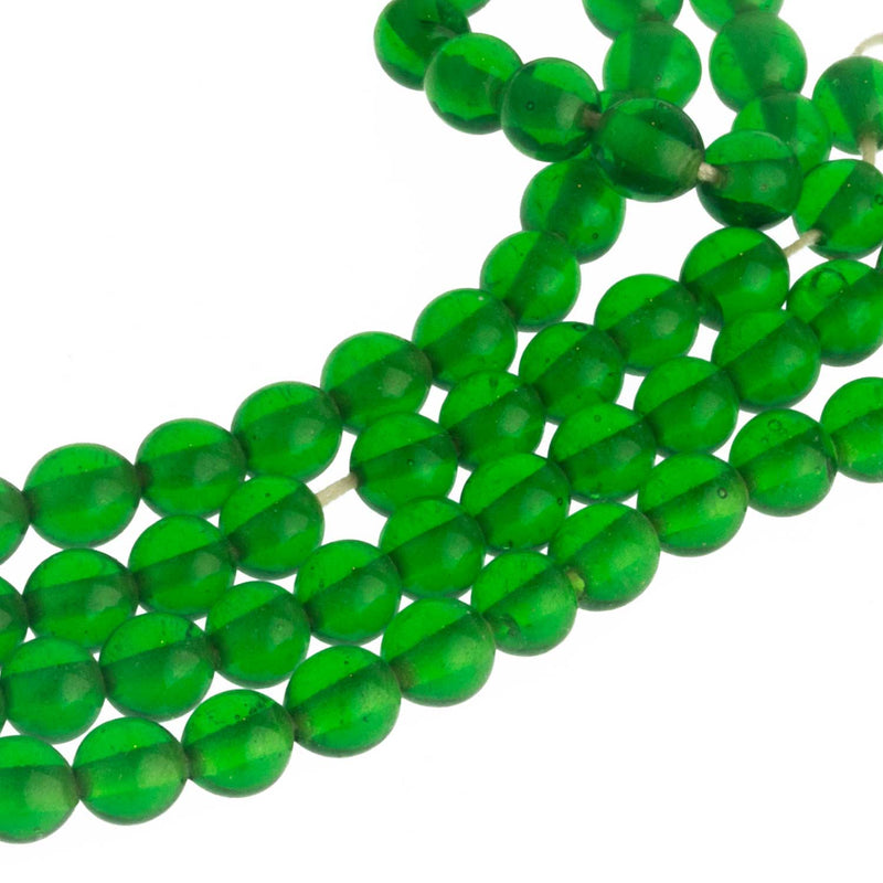 Vintage Japanese emerald green white core smooth rounds. 6mm. Pkg of 25.