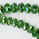 Olive green luster gemstone cut graduated 10mm x 5mm to 4mm x 2mm. 16.5 inch strand.