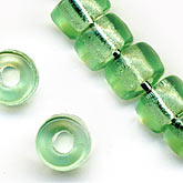 b11-gr-0842-Vintage German transparent green roller beads. 4x6mm. Pkg of 20