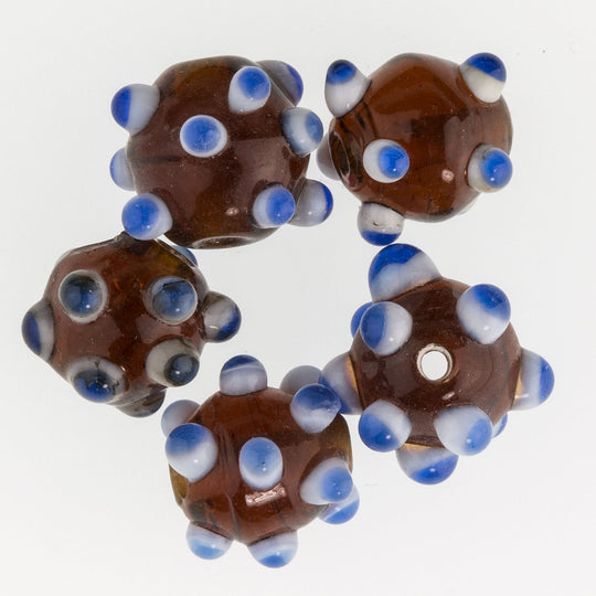Amber round with white and blue horns. 12mm Pkg of 6. b11-mi-0107