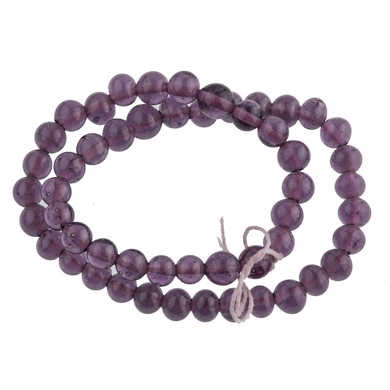 Vintage translucent amethyst glass rounds Japan 4mm strand of 55. 