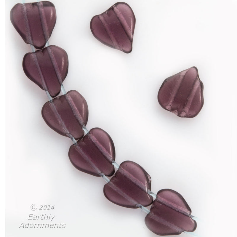 Vintage 1920s Czech 2 hole purple glass hearts. Package of 12.