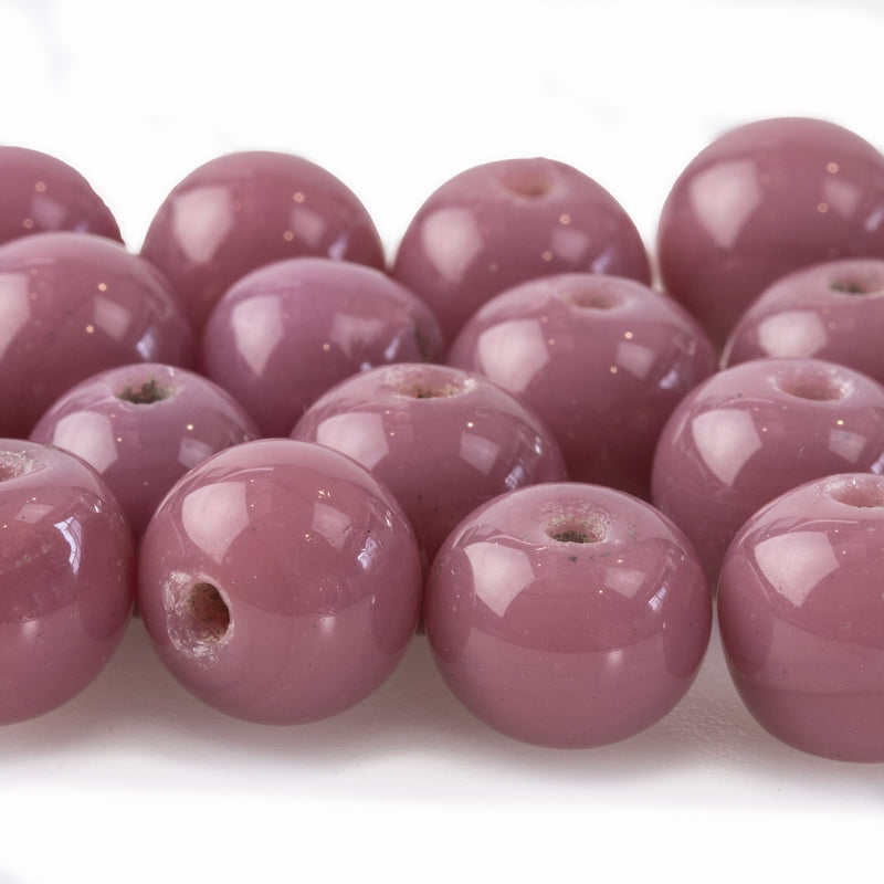 Antique Chinese wound glass bead in a rare opaque mauve.  11mm. Pkg. 2.