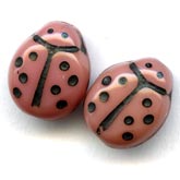 opaque pink coral ladybug beads. 9x7mm. Pkg of 10