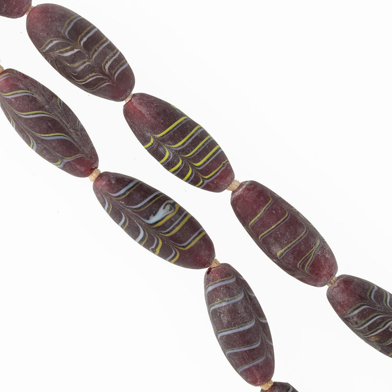 Vintage red feather beads from the African trade,  India. c.1980.  30x12mm. Pkg 1.