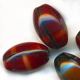 Cranberry red glass oval beads. 7x10mm Pkg of 5.
