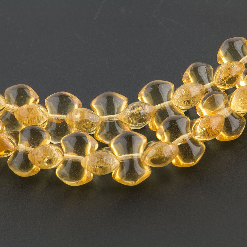 Vintage Post-WWII Czechoslovakian Interlocking Glass Beads. Bow-Tie Shaped. Transparent Amber Color. 1940s. 6x9mm. 20-bead Strand. Sold Individually.