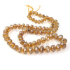 Graduated knotted strand gemstone-cut citrine luster glass bead strand.16 in. strand. 