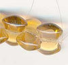 Vintage Post-WWII Czechoslovakian Interlocking Glass Beads. Bow-Tie Shaped. Transparent Amber Color. 1940s. 6x9mm. 20-bead Strand. Sold Individually.