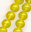 1960's Japanese lemon yellow semi-opaque wire-wound glass rounds. 8mm. Pkg. of 20.