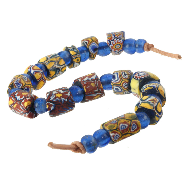 Venetian millefiori, African trade & blue Chinese/Peking glass beads. 9.25 in str