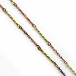 Vintage copper over steel 2 mm cable chain with brass twist links. Sold by the foot.