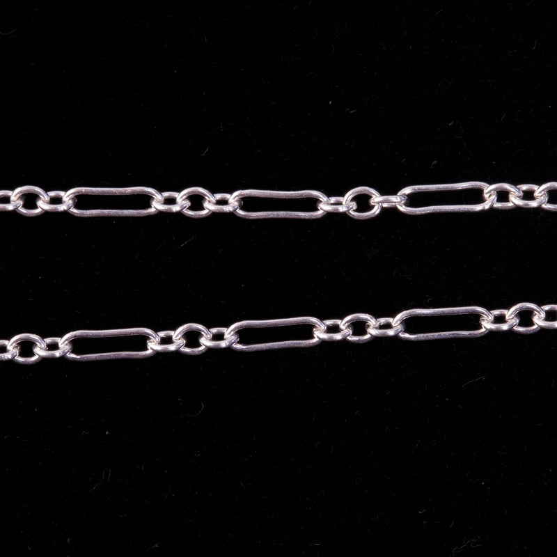 Sterling silver Figaro chain.7 x 2.5mm and 2.14mm links. Sold by the foot.
