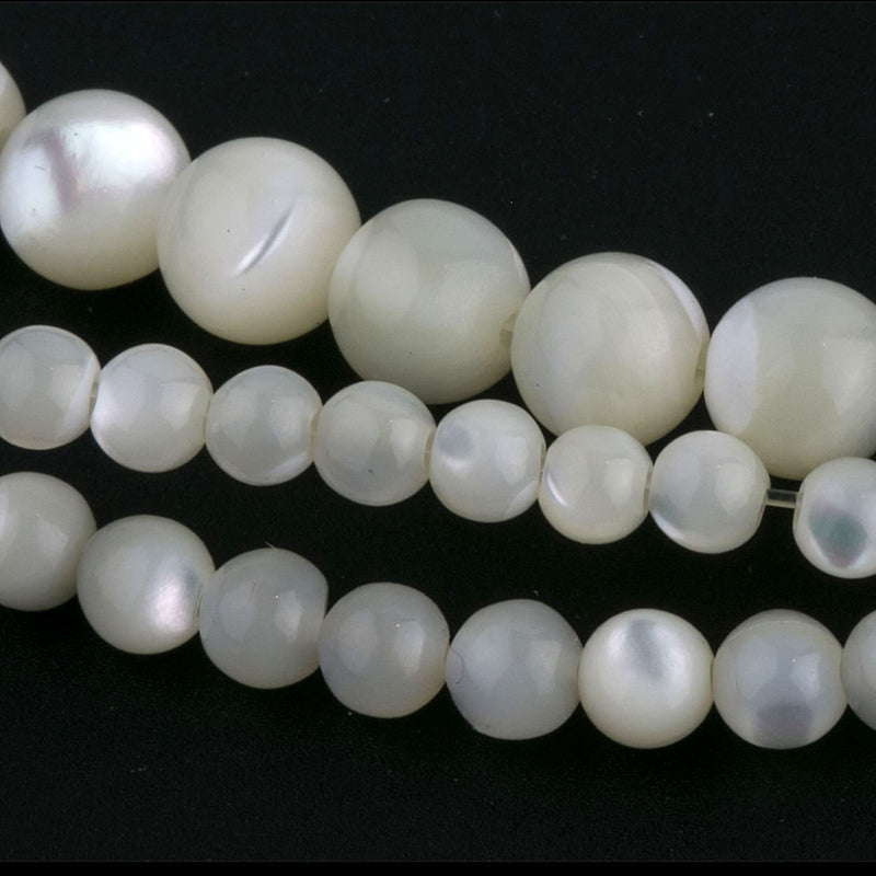 Vintage Mother of Pearl round beads in strands.  5 sizes. 