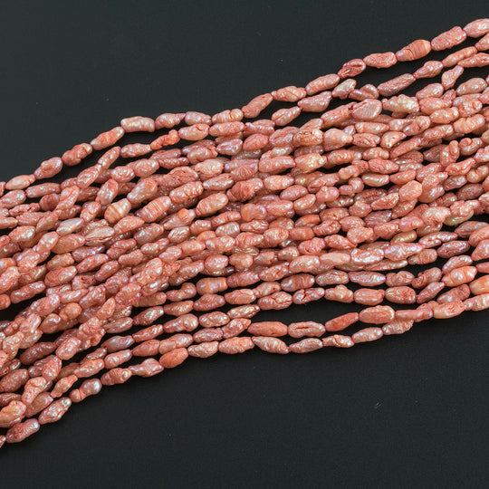 Vintage color treated iridescent freshwater oval rice pearl. Avg. 5x3mm, 16 inch strand. b15-prl124