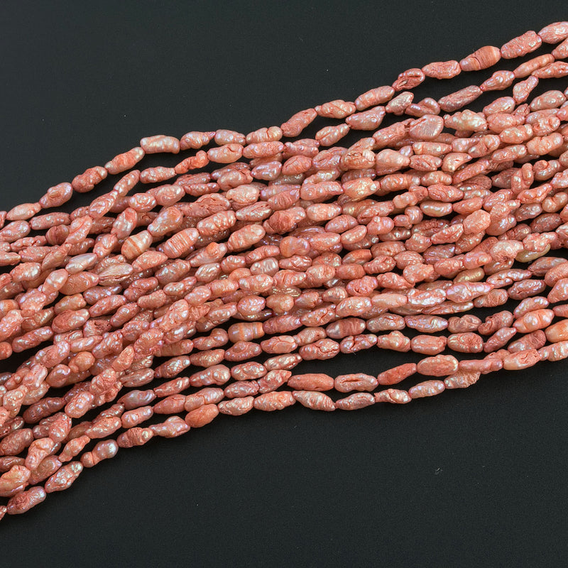 Vintage color treated iridescent freshwater oval rice pearl. Avg. 5x3mm, 16 inch strand.