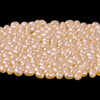 AA quality freshwater pearls, loose, ovals light apricot. 4x3mm. Pkg100. 1990s.