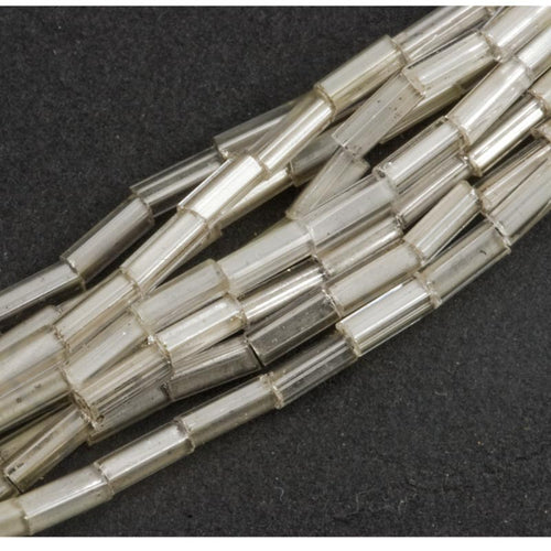 Vintage Japanese 5mm bugles, mixed strand white core, clear and silver core 9 gram hank.