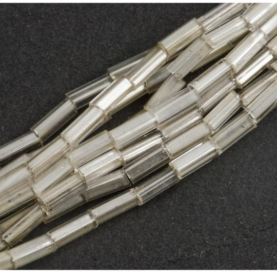 Vintage Japanese 5mm bugles, mixed strand white core, clear and silver core 9 gram hank. b17-148