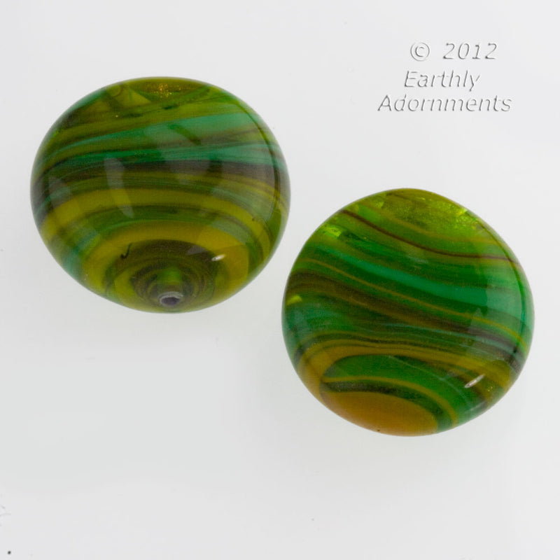 Contemporary lampwork disk made from old German and Italian glass. 28 x 10 mm. Sold indv.
