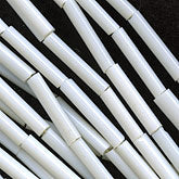 Antique Venetian opaque white bugles. 16mm. Per strand. b17-077