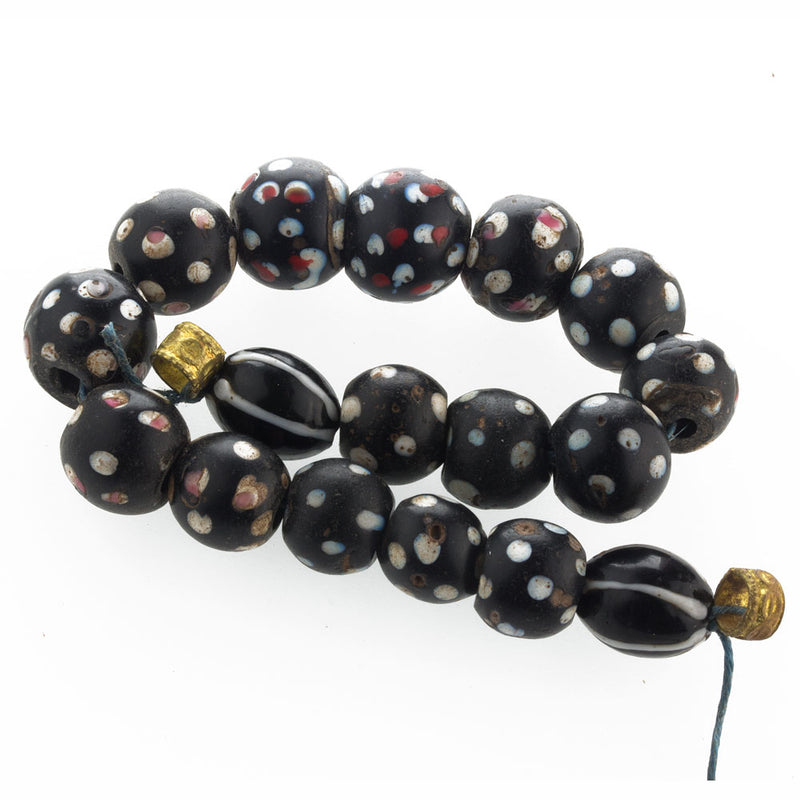 Strand of antique Venetian black glass eye beads, African trade.