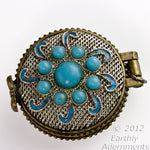 Silver on copper lacey filigree locket with turquoise glass