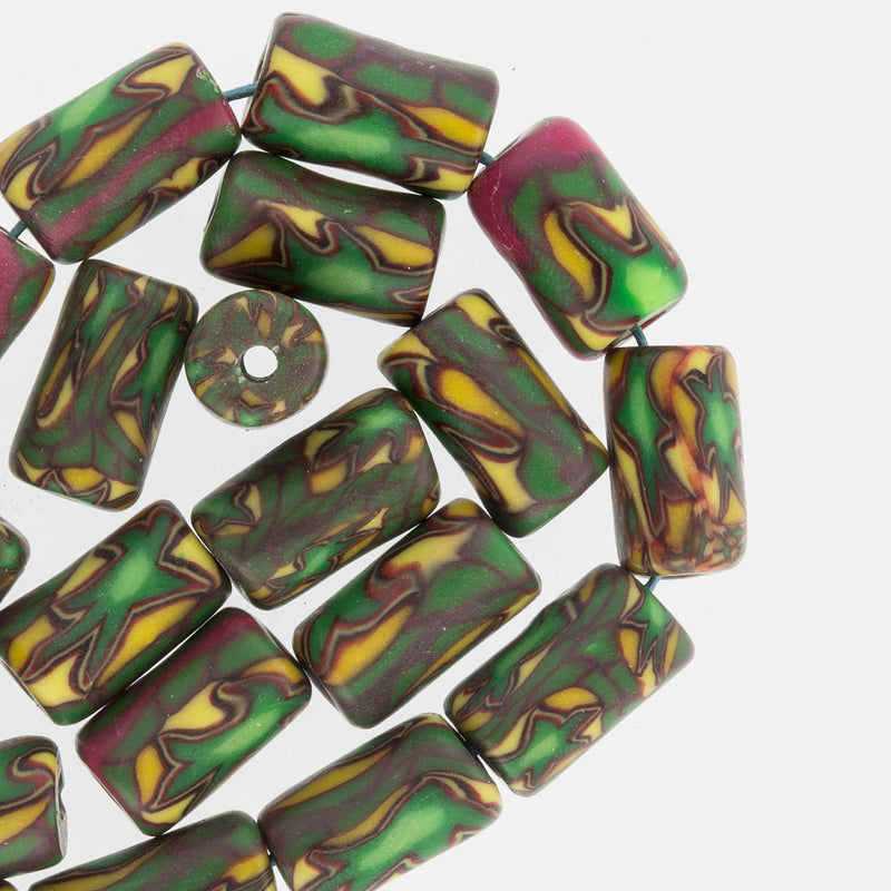 Fimo clay cylinder beads in the style of African trade beads.