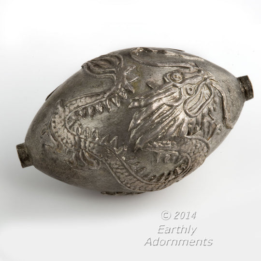 Large hollow coin silver egg shaped bead with repousse dragon