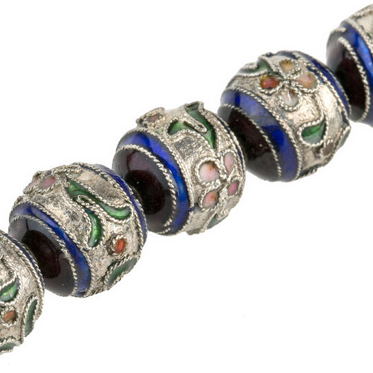b18-576- Silver metal hollow beads with purple and blue enamel caps and raised enamel flowers. 12mm. Package of 2. b18-576