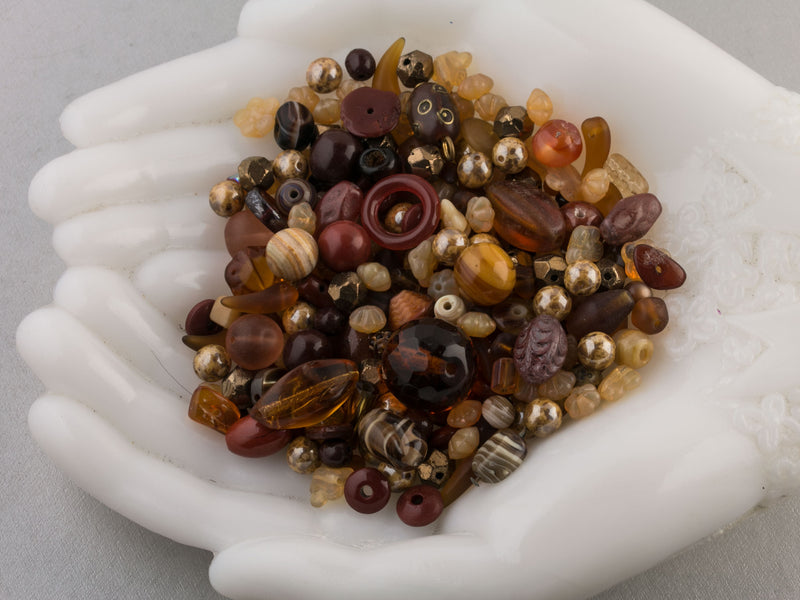 Vintage glass bead mix of butterscotch color beads from Europe, Japan and beyond.  5 oz box. Butterscotch.