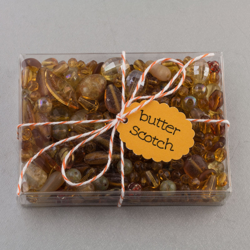 Vintage glass bead mix of butterscotch color beads from Europe, Japan and beyond.  5 oz box. Butterscotch.