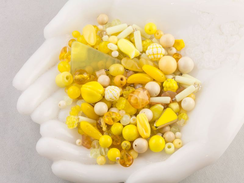 Vintage glass bead mix in an array of yellow colors from Europe, Japan and beyond.  5 oz box. Lemon Drop.