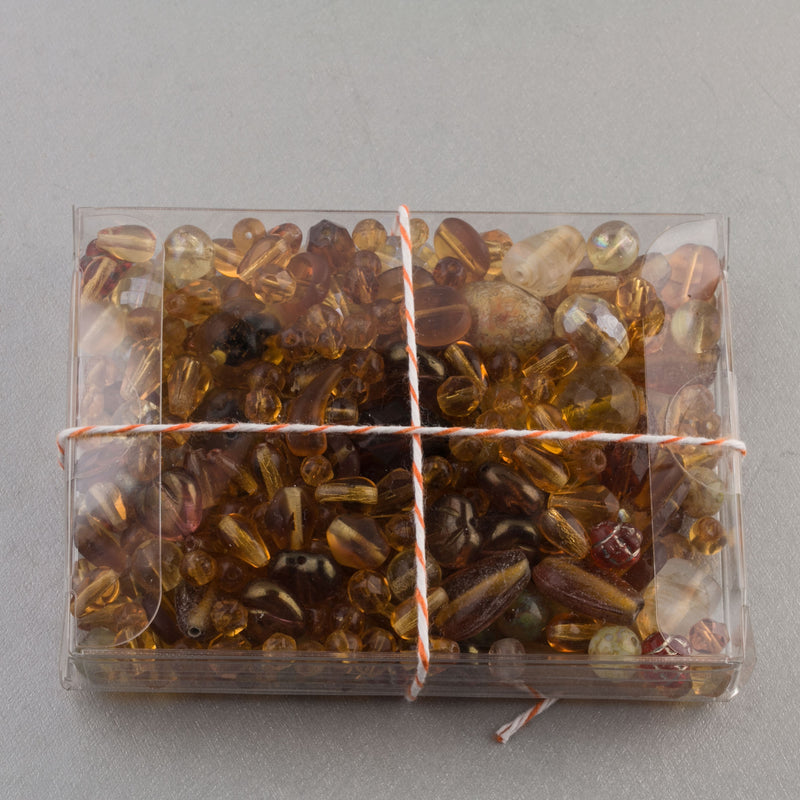 Vintage glass bead mix of butterscotch color beads from Europe, Japan and beyond.  5 oz box. Butterscotch.