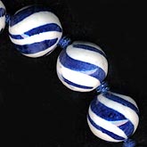Blue and white porcelain swirl rounds. 14mm. Pkg of 4.