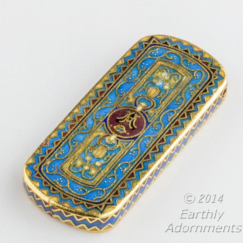 Cloisonné pendant. with blue and red enamel and gilt wire 50x22mm. Sold individually.